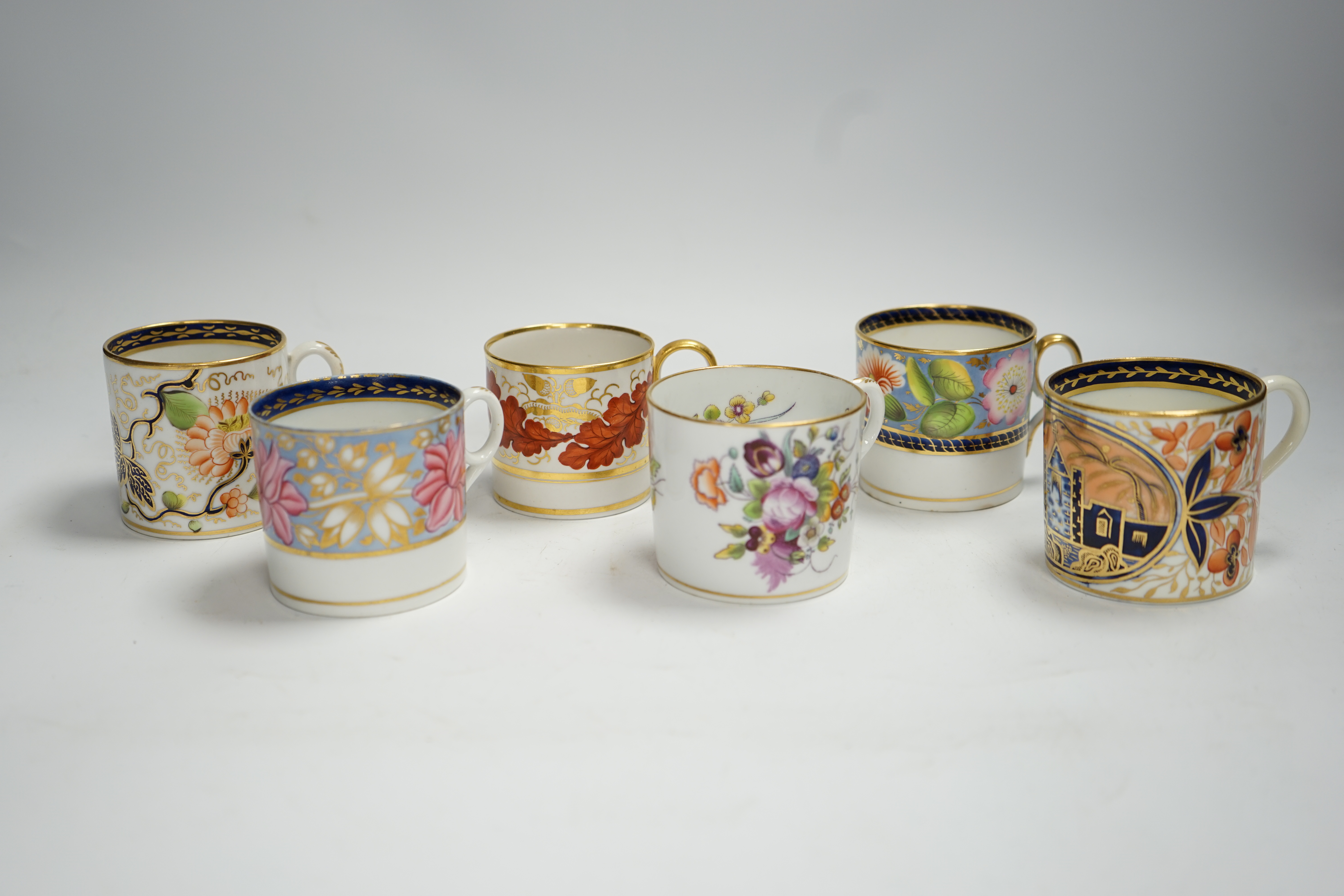 Twelve 1800-1820 English porcelain floral designed coffee cans